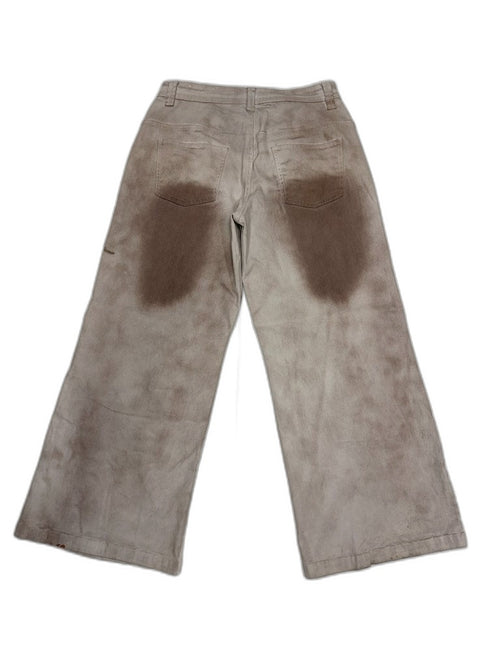 Back of smoke-dyed wide-leg pants showing organic brown dye blooms across white denim and wide flare silhouette — one of one reconstructed Not For Resale LA