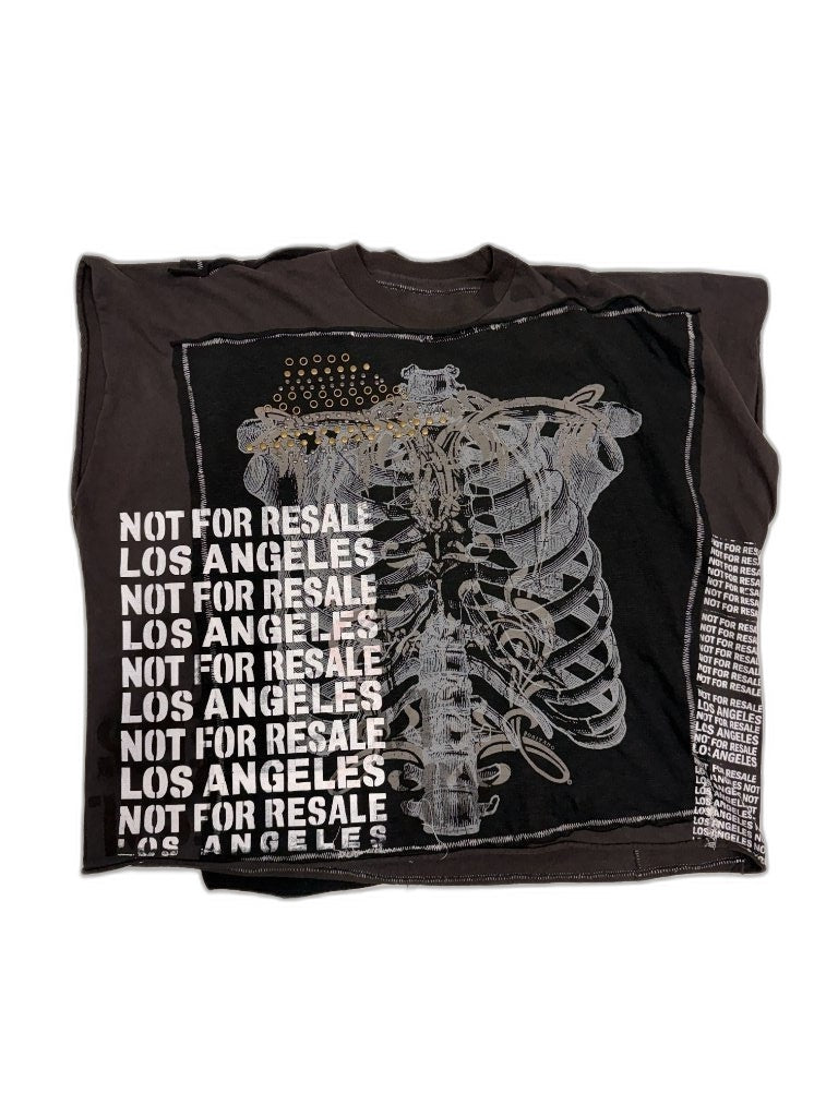 Front of black reconstructed tee with large sneaker screen print NOT FOR RESALE LOS ANGELES stencil gold metallic studs and NFR all-over print sewn border — one of one upcycled streetwear Not For Resale LA