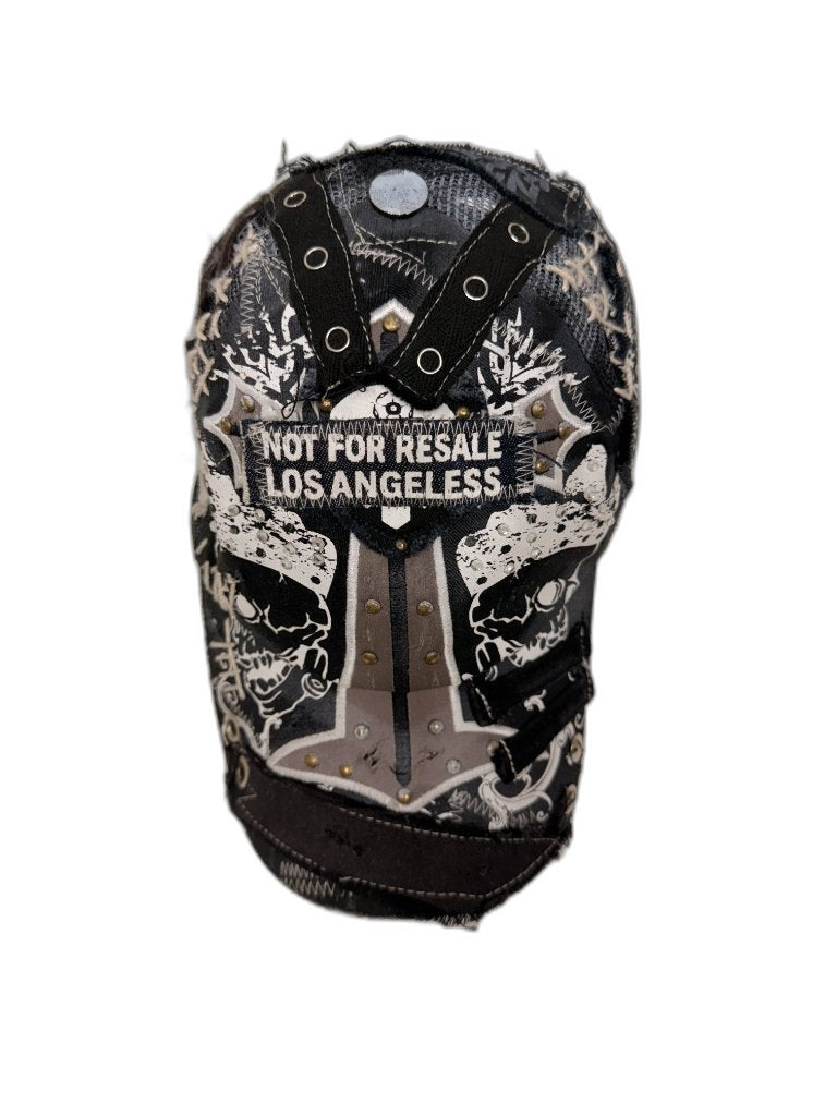 Top-down crown view of black skull cap showing full X strap webbing grommet construction and NOT FOR RESALE patch — one of one reconstructed NFR Los Angeles