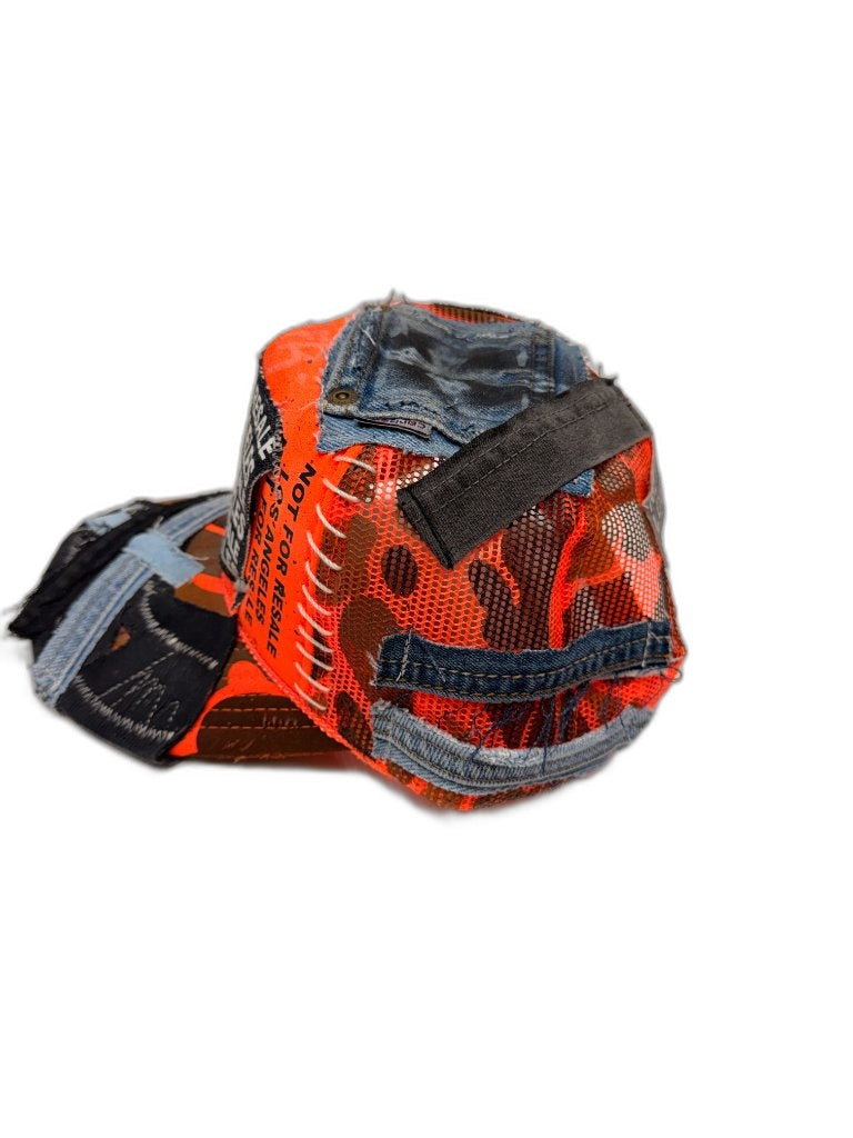 Back of orange camo cap showing orange mesh panel blue denim patches black velcro strap tab and NFR text — one of one reconstructed Not For Resale Los Angeles