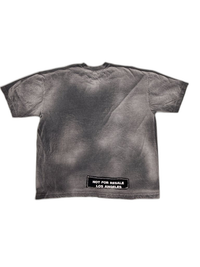 Back of smoke-dyed NFR tee showing grey spray treatment and NOT FOR RESALE LOS ANGELES woven patch on lower left — one of one upcycled Not For Resale Los Angeles