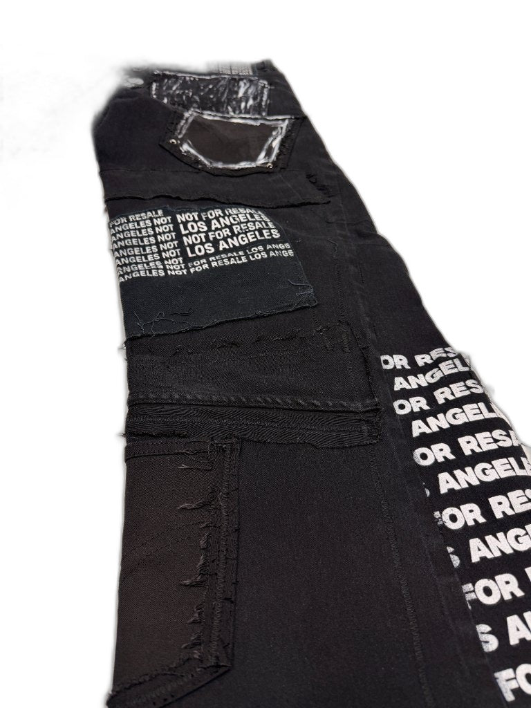 Back detail right leg showing NFR LOS ANGELES screen print block panel hand painted pocket black mesh patch raw seam construction and NOT FOR RESALE inseam text — one of one NFR LA