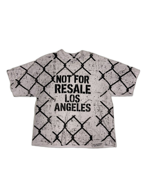 Front of white oversized tee with all-over chain-link fence screen print and bold NOT FOR RESALE LOS ANGELES center chest stencil plus NFR woven hem label — one of one reconstructed NFR LA