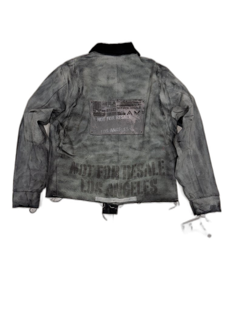 Back of grey smoke-dyed bomber jacket showing bold yellow gold NOT FOR RESALE LOS ANGELES stencil on dark charcoal fabric — one of one reconstructed NFR LA