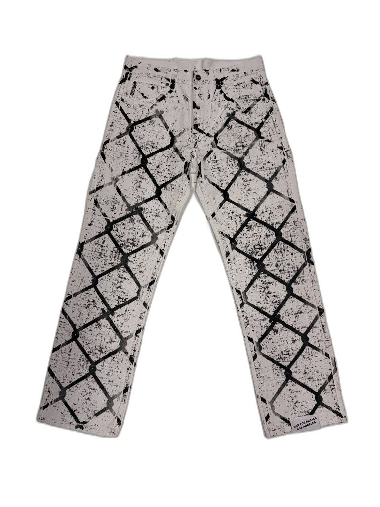 Front of white denim pants with all-over chain-link fence screen print bold black diamond grid distressed ink texture and NOT FOR RESALE LOS ANGELES woven hem label — one of one reconstructed NFR LA