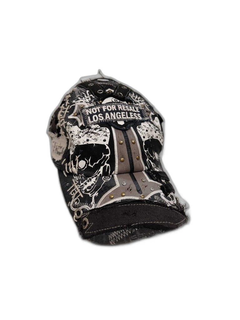 RECONSTRUCTED 001_26_06 — Black Skull Cap, Grommets, Gold Studs & NFR Patch