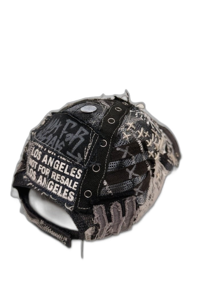 RECONSTRUCTED 001_26_06 — Black Skull Cap, Grommets, Gold Studs & NFR Patch