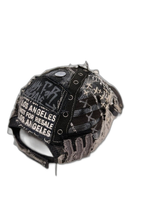 RECONSTRUCTED 001_26_06 — Black Skull Cap, Grommets, Gold Studs & NFR Patch