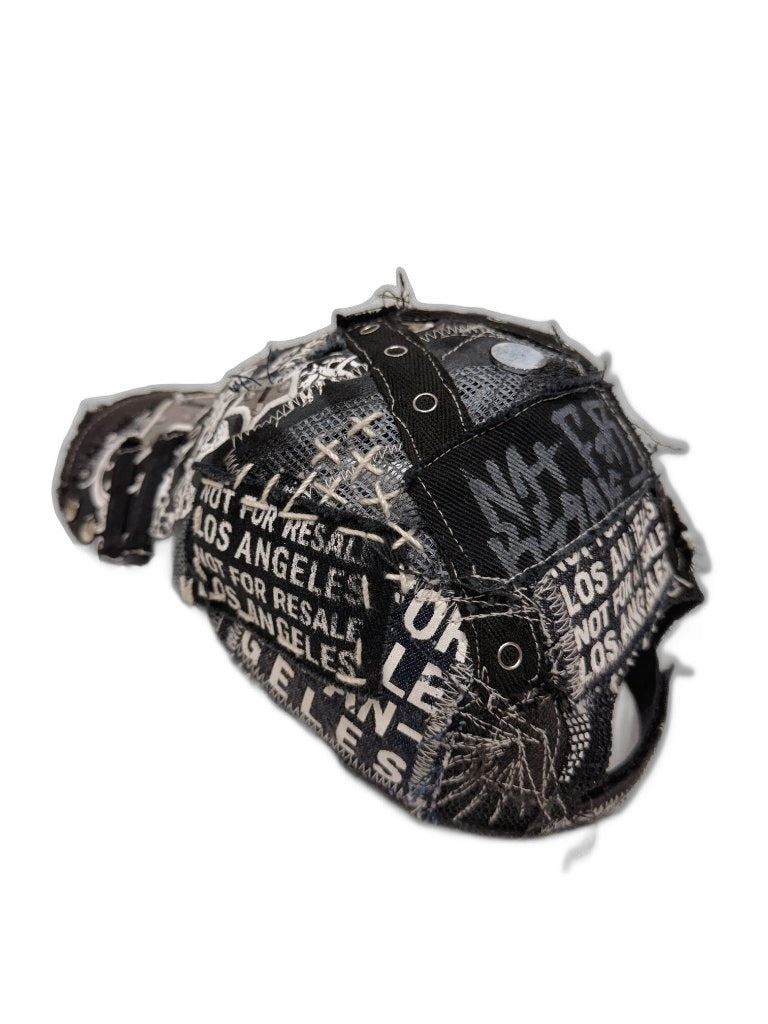RECONSTRUCTED 001_26_06 — Black Skull Cap, Grommets, Gold Studs & NFR Patch
