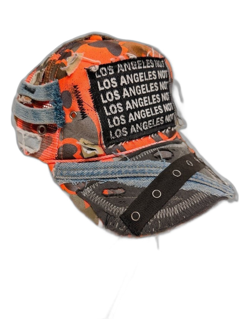 RECONSTRUCTED 001_26_08 — Orange Camo Cap, NFR Text Band & Silver Chain
